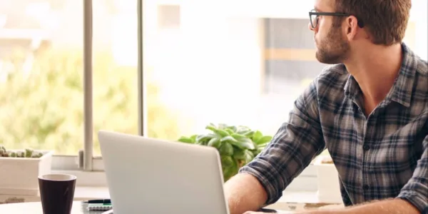 20151120172744-procrastination-young-man-home-office-laptop-distracted-work-distant