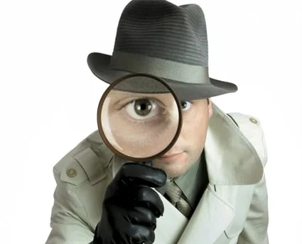 why-hire-Private-Investigator-Toronto-with-magnifying-glass
